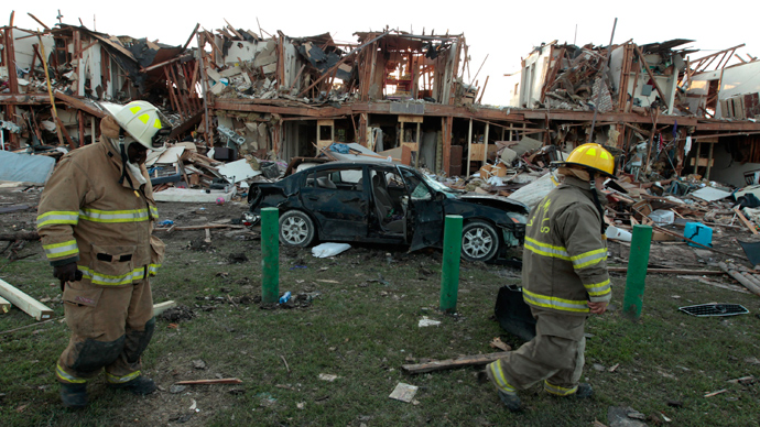 Valley Mills Fire Department personnel walk among the remains of an apartment complex next to the fertilizer plant that exploded yesterday afternoon on April 18, 2013 in West, Texas (AFP Photo / Erich Schlegel)