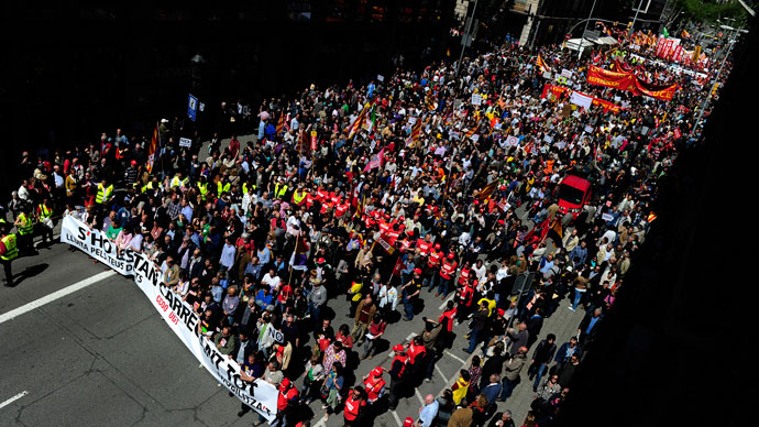 Demonstrators take part a Labour Day march against the Spanish government's austerity policies in the centre of Barcelona on May 1, 2013.(AFP Photo / Josep Lago)