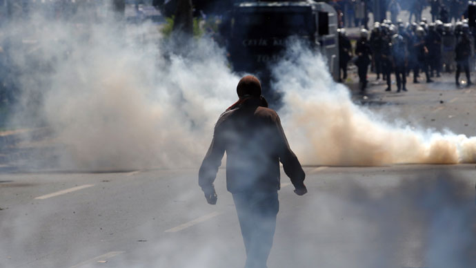 A protestor holds a stone during clashes with police at a May Day demonstration on May 1, 2013.(AFP Photo / Ozan Kose) 