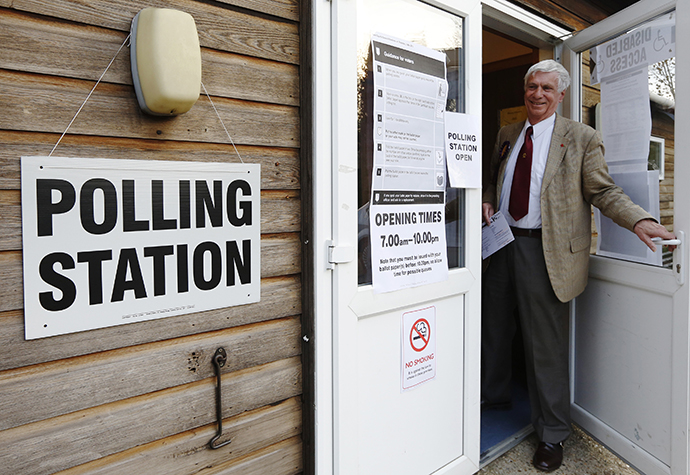 Norman Taylor, the UK Independence Party (UKIP) candidate in the Ashford Central local elections, prepares to cast his vote at Bethersden Village Hall, in Bethersden, near Ashford in southern England May 2, 2013. (Reuters / Luke MacGregor)