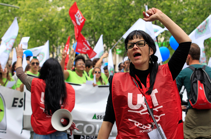 Demonstrators of the UGT (General Workers Union) shout slogans during a march along Avenue of Liberdade (Freedom) in Lisbon May 1, 2013 (Reuters / Jose Manuel Ribeiro)