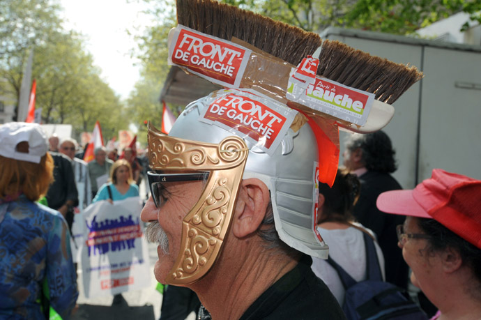 A man wearing a Roman helmet made with a broom takes part in a demonstration on May 5, 2013 in Paris, called by Jean-Luc Melenchon, leader of Front de Gauche (Left Front) left wing party, to protest "against the austerity, against the finance and to ask for a Sixth Republic". (AFP Photo)