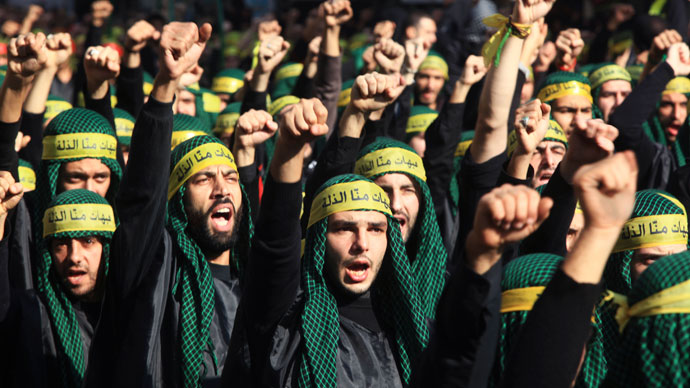 Lebanon's Hezbollah supporters gesture as they march during a ceremony to mark Ashura in Beirut's suburbs, November 25, 2012.(Reuters / Khalil Hassan)