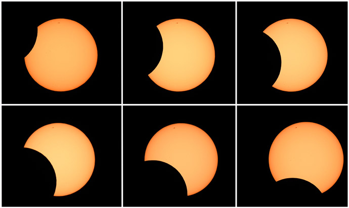 This combination of six photos shows the moon crossing in front of the sun (clockwise from top L) as seen from the Sydney Observatory during an annular eclipse on May 10, 2013. (AFP Photo/William West)