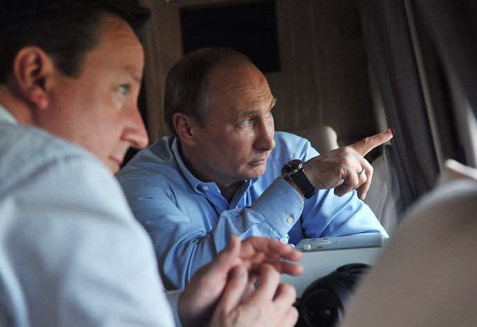 Russian President Vladimir Putin, left, and British Prime Minister David Cameron during a helicopter inspection of the main Olympic venues in the Imereti Valley of Sochi. (RIA Novosti/Aleksey Nikolskyi)