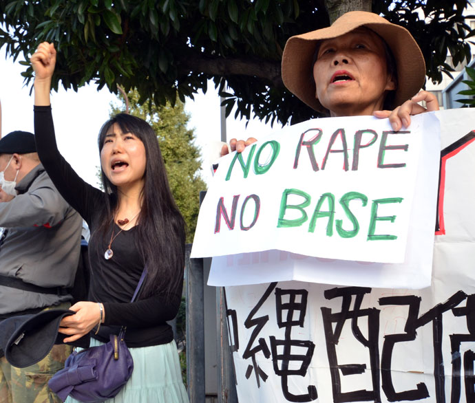  Civic group members shout slogans and hold placards as they attend a protest over the alleged rape of a local woman by two US servicemen in Okinawa, in front of the prime minister's official residence in Tokyo on October 20, 2012.(AFP Photo / Yoshikazu Tsuno)