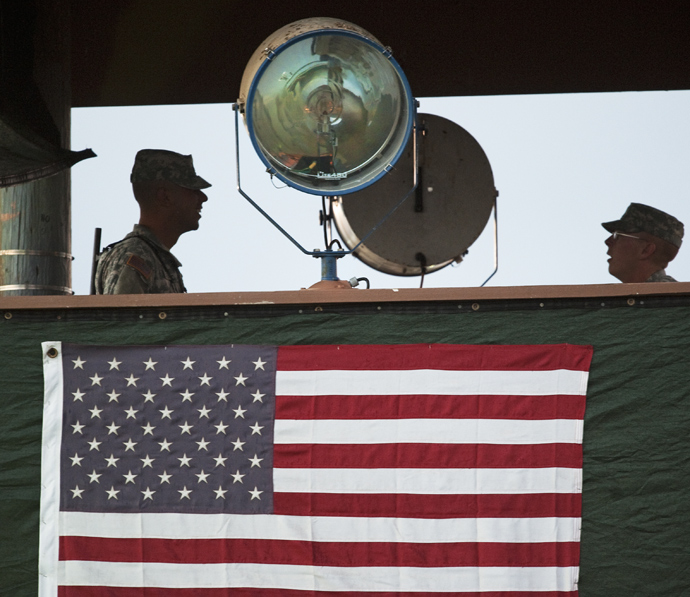 US Army guards man the guard tower overlooking Camp Delta at Guantanamo Bay, Cuba (AFP Photo / Paul J. Richards)
