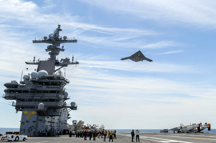 This May 14, 2013 US Navy handout image shows an X-47B Unmanned Combat Air System (UCAS) demonstrator flying over the aircraft carrier USS George H.W. Bush (CVN 77) during flight operations in the Atlantic Ocean. This May 14, 2013 US Navy handout image shows an X-47B Unmanned Combat Air System (UCAS) demonstrator launching from the deck of the aircraft carrier USS George H.W. Bush (CVN 77) during flight operations in the Atlantic Ocean. (US Navy courtesy of Northrop Grumman /Alan Radecki)