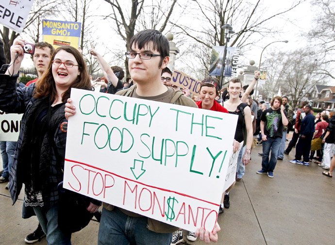 Members of "Occupy" movements in the Midwest protest against Monsanto's agricultural practices in front of the Missouri Botanical Garden during the "Occupy the Midwest" regional conference in St. Louis, Missouri March 16, 2012. (Reuters/Sarah Conard)