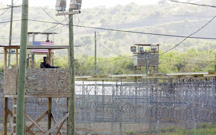 A US Marine manning an observation tower surveys the outside of Camp X-Ray where 110 Al-Qaeda and Taliban detainees are being currently held by US authorities at the US Guantanamo US Naval Base in Guantanamo Bay, Cuba, 17 January 2002.(AFP Photo)