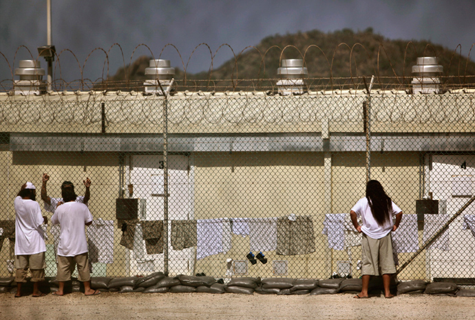 Detainees talk together inside the open-air yard at the Camp 4 detention facility at Guantanamo Bay U.S. Naval Base in Cuba (Reuters / Brennan Linsley)