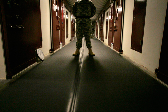 A U.S. Army guard stands in a corridor of cells in Camp Five, a facility at the Guantanamo Bay Naval Station in Guantanamo Bay, Cuba (Reuters / Joe Skipper)