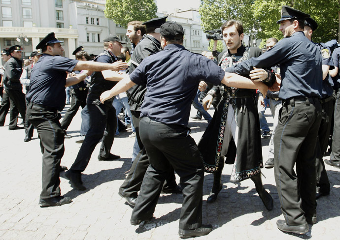 Policemen try to stop an Orthodox Christian activist during clashes with gay rights activists at an International Day Against Homophobia and Transphobia (IDAHO) rally in Tbilisi, May 17, 2013. (Reuters)