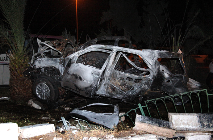 A handout picture released by the Syrian Arab News Agency (SANA) on May 18, 2013, shows the debris of a car at the site of a car bomb in the north Damascus neighbourhood of Rukneddin (AFP Photo / SANA)