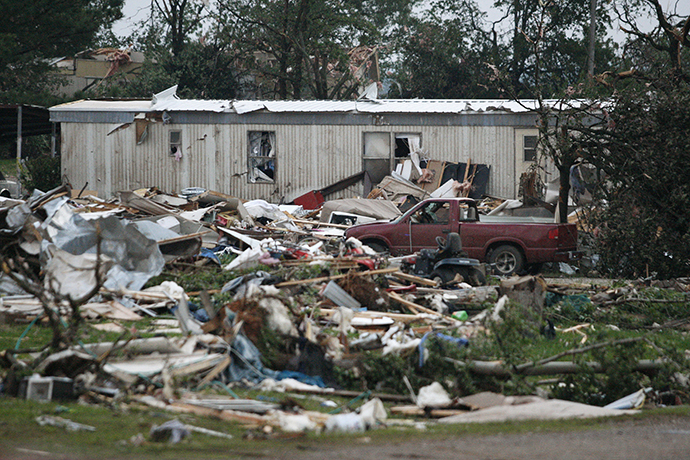 Debris is seen at a mobile home park which was destroyed by a tornado on Sunday, west of Shawnee, Oklahoma May 19, 2013. (Reuters / Bill Waugh)