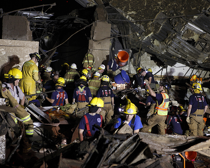 Oklahoma National Guard soldiers and rescue workers dig through the rubble of Plaza Tower Elementary school May 21, 2013 after a devastating tornado ripped through Moore, Oklahoma, May 20. (Reuters)