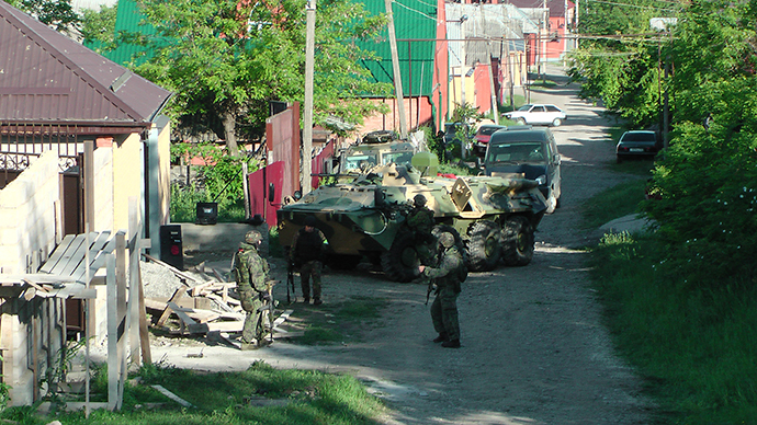 Russian Special Forces troops with a BTR armored personnel carrier cordon off the area of the shootout in Nazran District of the North Caucasus Republic of Ingushetia on May 21, 2013. Photo: National Antiterrorism Committee (NAC)