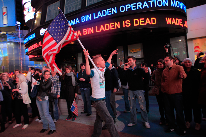 People react to the death of Osama bin Laden in Times Square in New York early May 2, 2011 (Reuters / Eric Thayer)