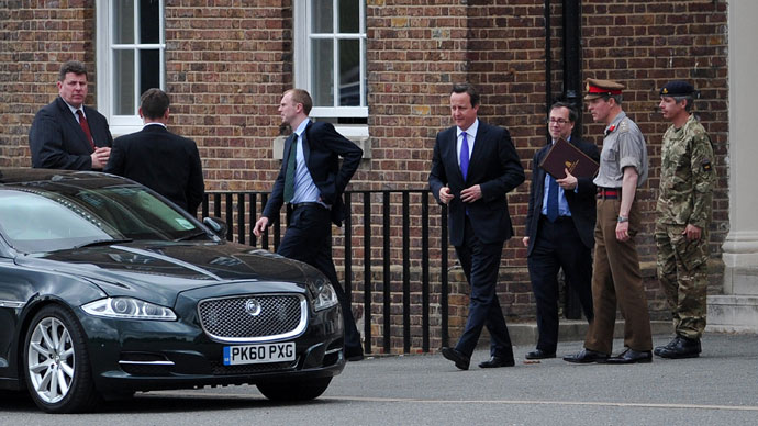 Police officers man a cordoned off area in Woolwich, east London, on May 22, 2013, following an incident in which a man was killed and two others seriously injured (AFP Photo / Leon Neal)