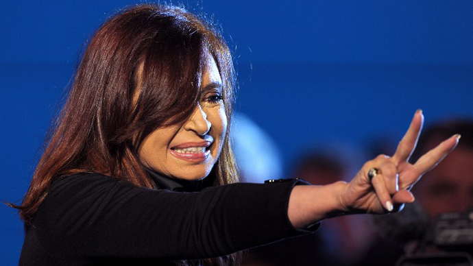 Argentine President Cristina Fernandez de Kirchner gestures to supporters at Plaza de Mayo square in Buenos Aires on May 25, 2013. (AFP Photo / Alejandro Pagni)