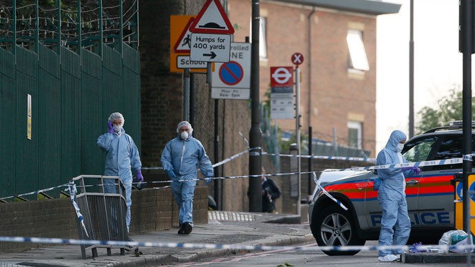 Police forensics officers investigate a crime scene where one man was killed in Woolwich, southeast London May 22, 2013.(Reuters / Stefan Wermuth)