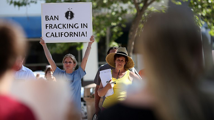 A protestor holds a sign against fracking during a demonstration outside of the California Environmental Protection Agency (EPA) headquarters on July 25, 2012 in Sacramento, California. (AFP Photo / Justin Sullivan)