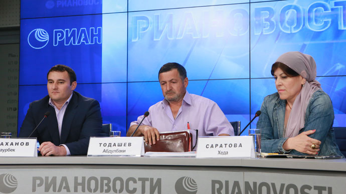 From left: lawyer Zaurbek Sadakhanov of the Moscow Interterritorial Bar Association, Abdulbaki Todashev, the father of Ibragim Todashev, and human rights activist Kheda Saratova, head of the Objective independent information and analysis agency, at the RIA press conference on May 30, 2013. (RIA Novosti / Alexander Natruskin)