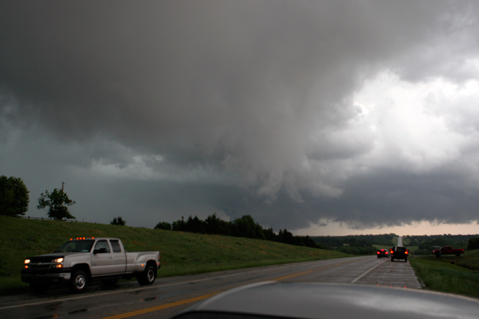 Storm chasers follow two large cloud lowerings near Cushing, Oklahoma (Reuters / Bill Waugh)