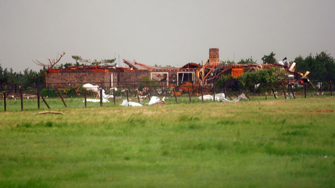 A home, damaged by a tornado, is seen south along Interstate-40 eastbound just east of El Reno, Oklahoma May 31, 2013.(Reuters / Bill Waugh)