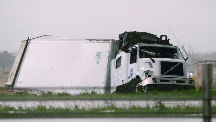A semi tractor-trailer is seen damaged along Interstate-40 Westbound after a tornado hit the area just east of El Reno, Oklahoma May 31, 2013.(Reuters / Bill Waugh)