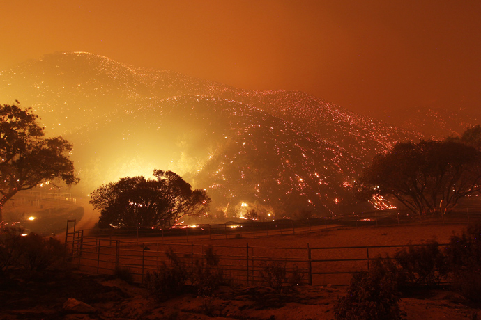 The landscape glows immediately after the main fire front swept over in a fast run toward Lake Hughes on June 1, 2013 south of Lake Hughes, California (AFP Photo / David McNew)