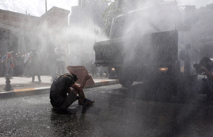 Turkish riot police use water cannon to disperse demonstrators during a protest against the destruction of trees in a park brought about by a pedestrian project, in Taksim Square in central Istanbul May 31, 2013 (Reuters / Osman Orsal)