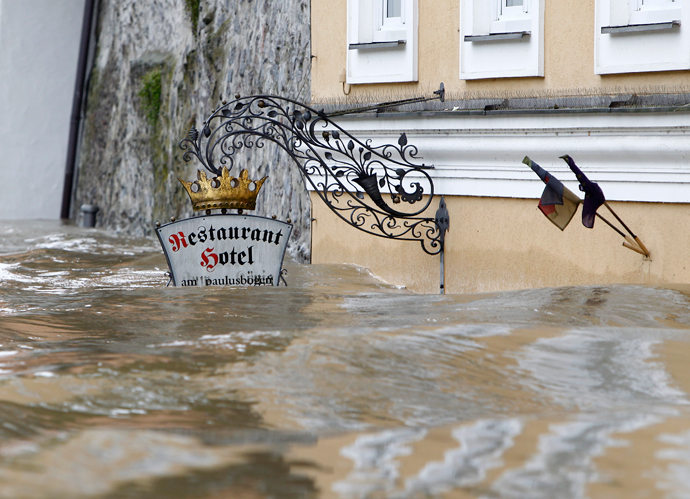 The sign above the door of restaurant and hotel 'Am Paulusbogen' is partially submerged in the flooded centre of the Bavarian town of Passau, about 200 km north-east of Munich June 3, 2013 (Reuters / Michaela Rehle)