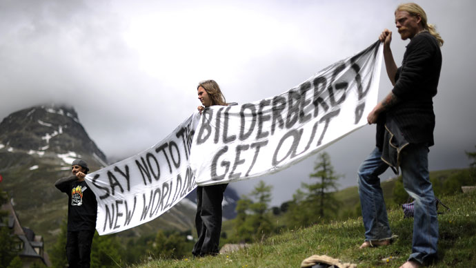 Activists protest on June 9, 2011 in front of the Suvretta House five-star hotel in the chic Swiss ski station of St Moritz, where the Bilderberg Group is holding its annual meeting.(AFP Photo / Fabrice Coffrini)