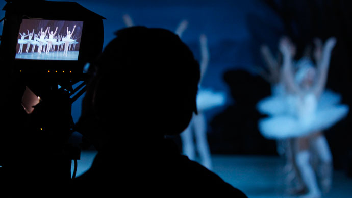 A cameraman films members of the Mariinsky theatre performing during a rehearsal for filming in St.Petersburg June 2, 2013.(Reuters / Alexander Demianchuk)