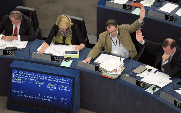 Members of the EU Parliament take part in a voting session on the implications for EU citizens' privacy of the US Prism and other internet surveillance cases, on July 4, 2013 during a session of the European Parliament in Strasbourg, eastern France. (AFP Photo/Frederick Florin)