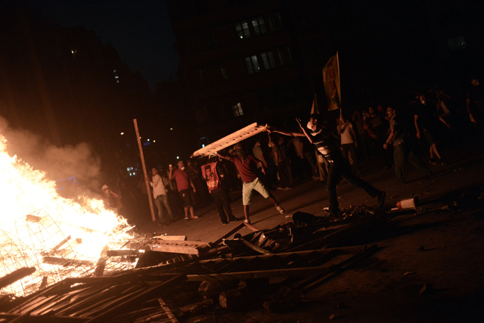 Protesters clash with riot police at Taksim square in Istanbul on June 11, 2013. (AFP Photo / Aris Messinis)