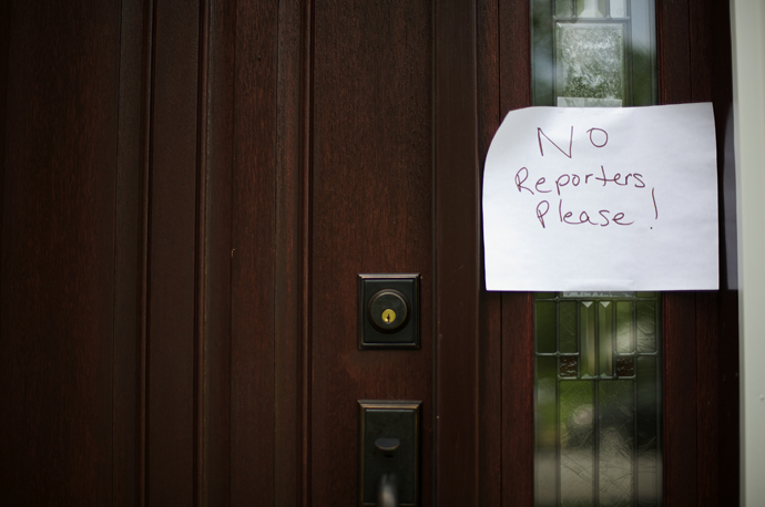 A sign reading "No Reporters Please" is posted on the front door of the house belonging to Lonnie and Karen Snowden, father and stepmother of NSA whistle-blower Edward Snowden, in Upper Macungie Township, Pennsylvania June 11, 2013. (Reuters / Mark Makela)