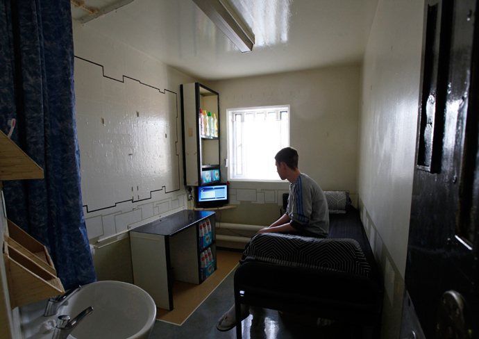 A prisoner sits in his cell on the resettlement wing in Doncaster Prison, northern England (Reuters / Darren Staples)