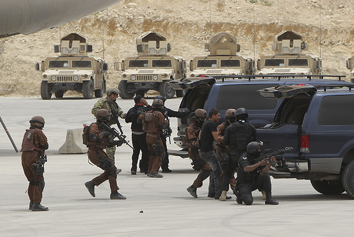 Jordanian and U.S. special forces demonstrate their skills at the King Abdullah Special Operations Training Centre during their "Eager Lion" military exercise in Amman May 27, 2012. (Reuters / Ali Jarekji)