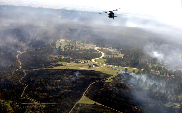 A U.S. Army Blackhawk helicopter patrols over the Black Forest Fire in Black Forest, Colorado June 13, 2013 (Reuters / Rick Wilking)