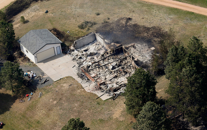 An aerial view of a destroyed house in the aftermath of the Black Forest Fire in Black Forest, Colorado June 13, 2013 (Reuters / Rick Wilking)