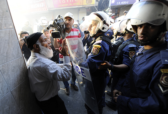 Riot police detain an anti-government protester in Manama October 12, 2012. (Reuters)