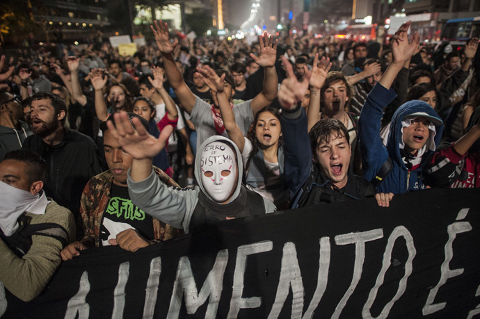  Students protest against the rise in public bus and subway fares from 3 reais to 3.20 reais (1.50 USD) in Sao Paulo on June 11, 2013. (AFP Photo/Nelson Almeida)