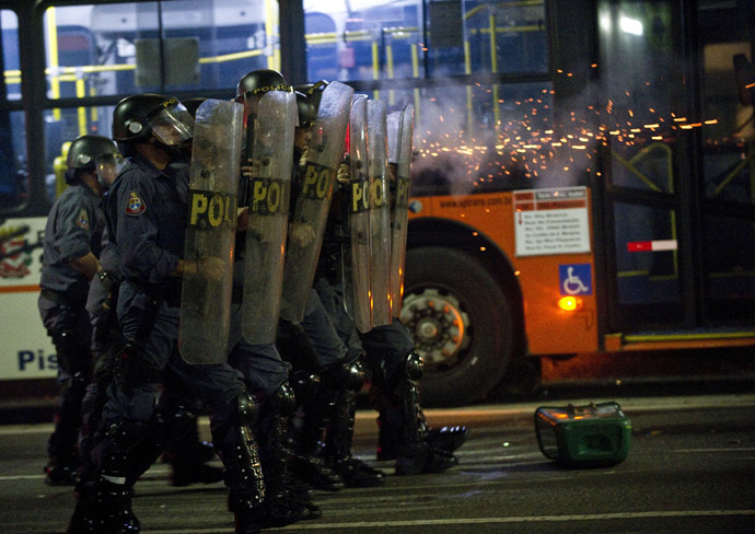 Riot police clash with students protesting in downtown Sao Paulo, Brazil on June 13, 2013, against a recent rise in public bus and subway fare from 3 to 3.20 reais (1.50 USD). (AFP Photo/Nelson Almeida)