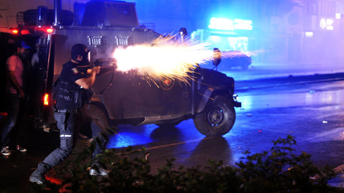 Riot police fires tear gas bomb to disperse protesters at Harbiye near Taksim square in Istanbul, on June 16, 2013.(AFP Photo / Ozan Kose)