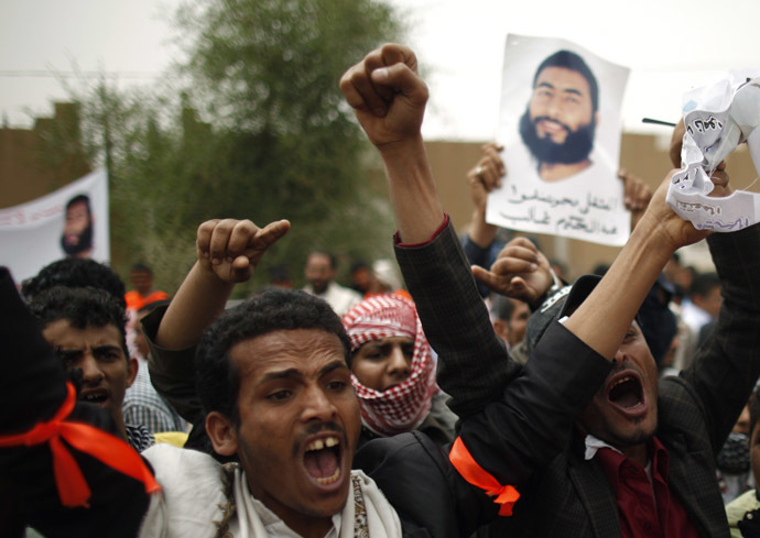 Relatives of Yemeni detainees at the Guantanamo Bay prison shout slogans during a protest to demand the release of the detainees, outside the U.S. embassy in Sanaa June 17, 2013. (Reuters / Khaled Abdullah Ali Al Mahdi)