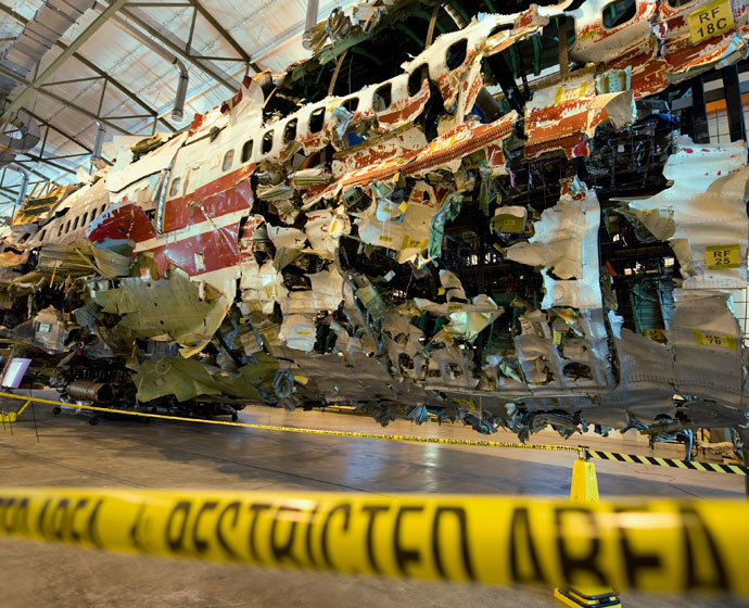 The re-assembled shell of TWA flight #800 sits inside a hangar at the National Transportation Safety Board (NTSB) training facility during a press conference July 16, 2008 in Ashburn, Virginia.(AFP Photo / Paul J. Richards)