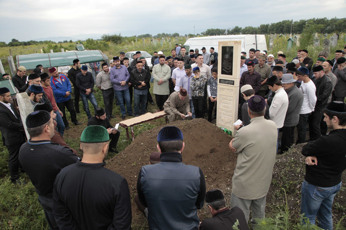 Relatives and friends of Ibragim Todashev, Tsarnaev brothers' friend killed by FBI in Florida, attend his funeral in a Muslim cemetery outside Chechnya's provincial capital Grozny, on June 20, 2013. (AFP Photo)