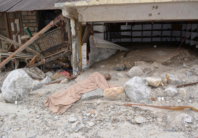 A body lies amid damaged surroundings by flood waters near Kedarnath Temple at Rudraprayag in the Himalayan state of Uttarakhand June 20, 2013. (Reuters)